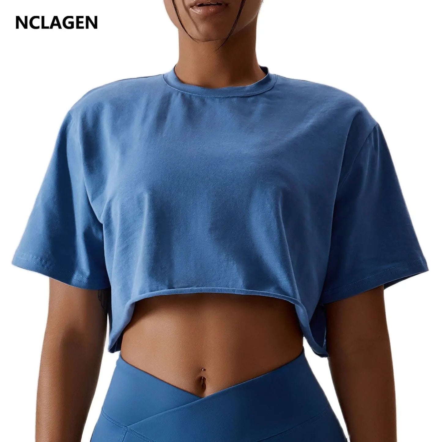 Stylish NCLAGEN Casual T-shirt in a chic blue hue, designed for ultimate comfort and freedom of movement. Made from breathable cotton and spandex, this crop top is perfect for yoga, dance, or running. Enjoy the loose fit and quick