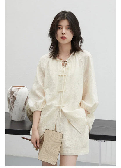 Discover the elegance of our **Embroidered Chinese Blouse & Shorts Set**, designed for the modern fashionista. This exquisite outfit features intricate Chinese embroidery and is crafted from soft, breathable fabric for ultimate comfort. The relaxed fit flatters all body types