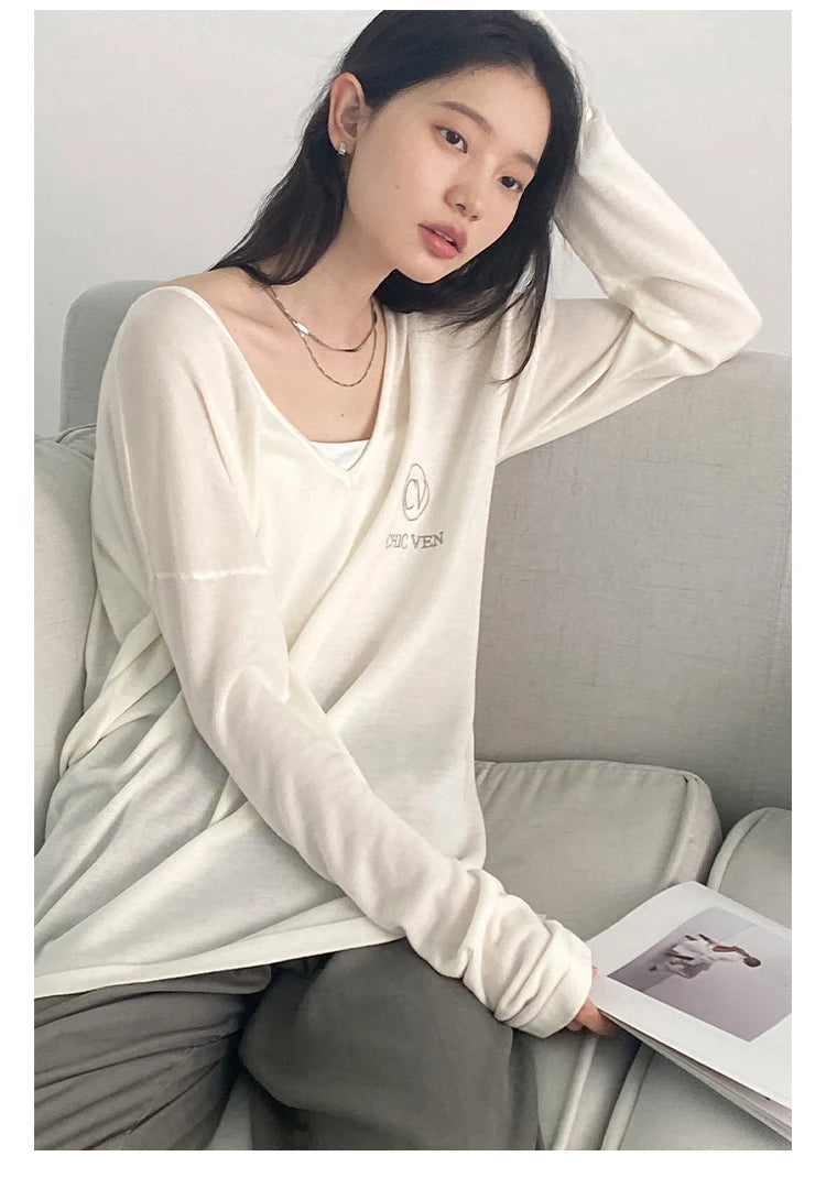 Discover the ultimate in casual elegance with our Loose V-Neck Embroidered T-Shirt. Crafted from lightweight, breathable fabric, this tee not only keeps you cool but also adds a touch of sophistication to your Spring/Summer wardrobe. The beautifully embroidered details