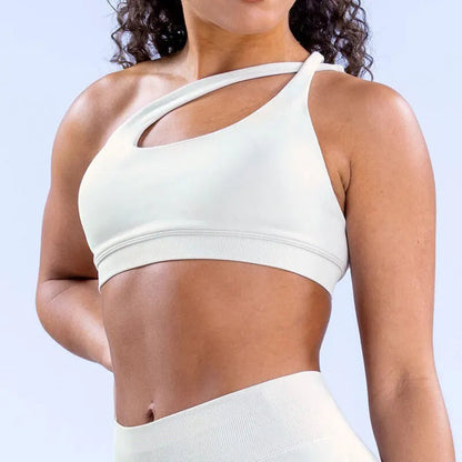 Elevate your fitness fashion with the NCLAGEN Impact Asymmetric Sports Bra. This stylish halter design offers high support for yoga and intense workouts, ensuring you stay comfortable and confident. Crafted from quick-dry, breathable nylon, it features a modern