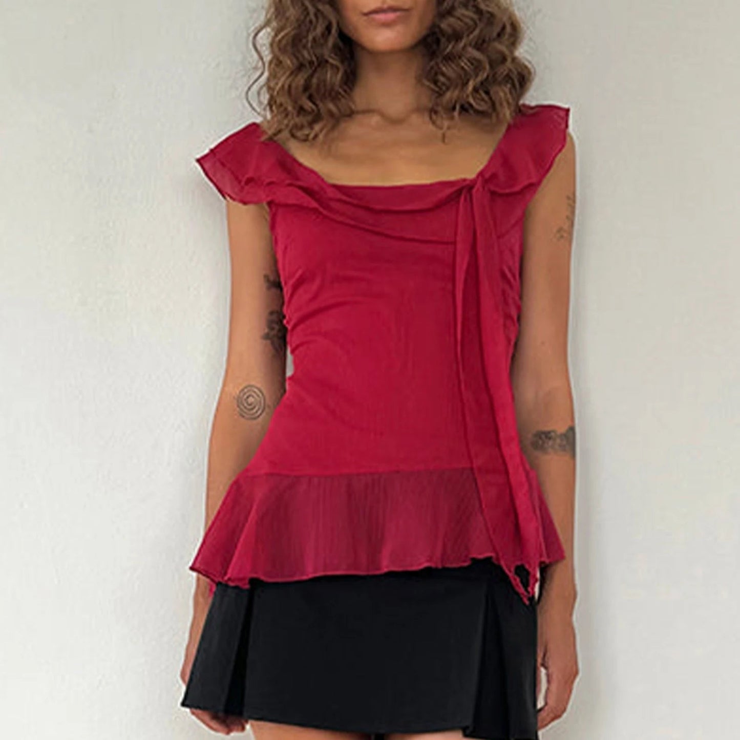 Stylish Y2K-inspired crop top featuring a charming ruffle trim and square neck design, crafted from a soft cotton-polyester blend for all-day comfort. Perfect for sunny days, this lightweight chiffon tank pairs beautifully with high-waisted shorts or skirts