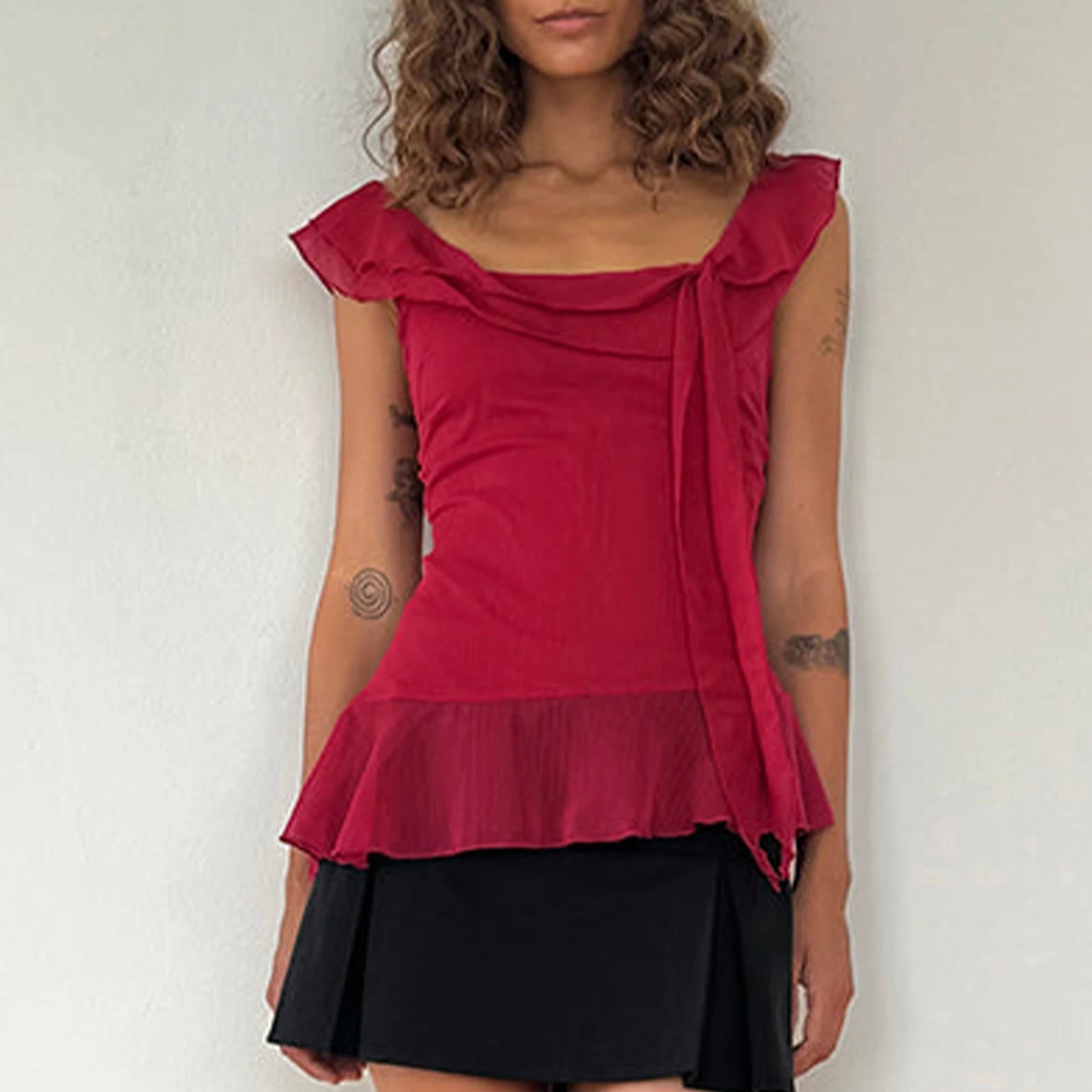 Stylish Y2K-inspired crop top featuring a charming ruffle trim and square neck design, crafted from a soft cotton-polyester blend for all-day comfort. Perfect for sunny days, this lightweight chiffon tank pairs beautifully with high-waisted shorts or skirts