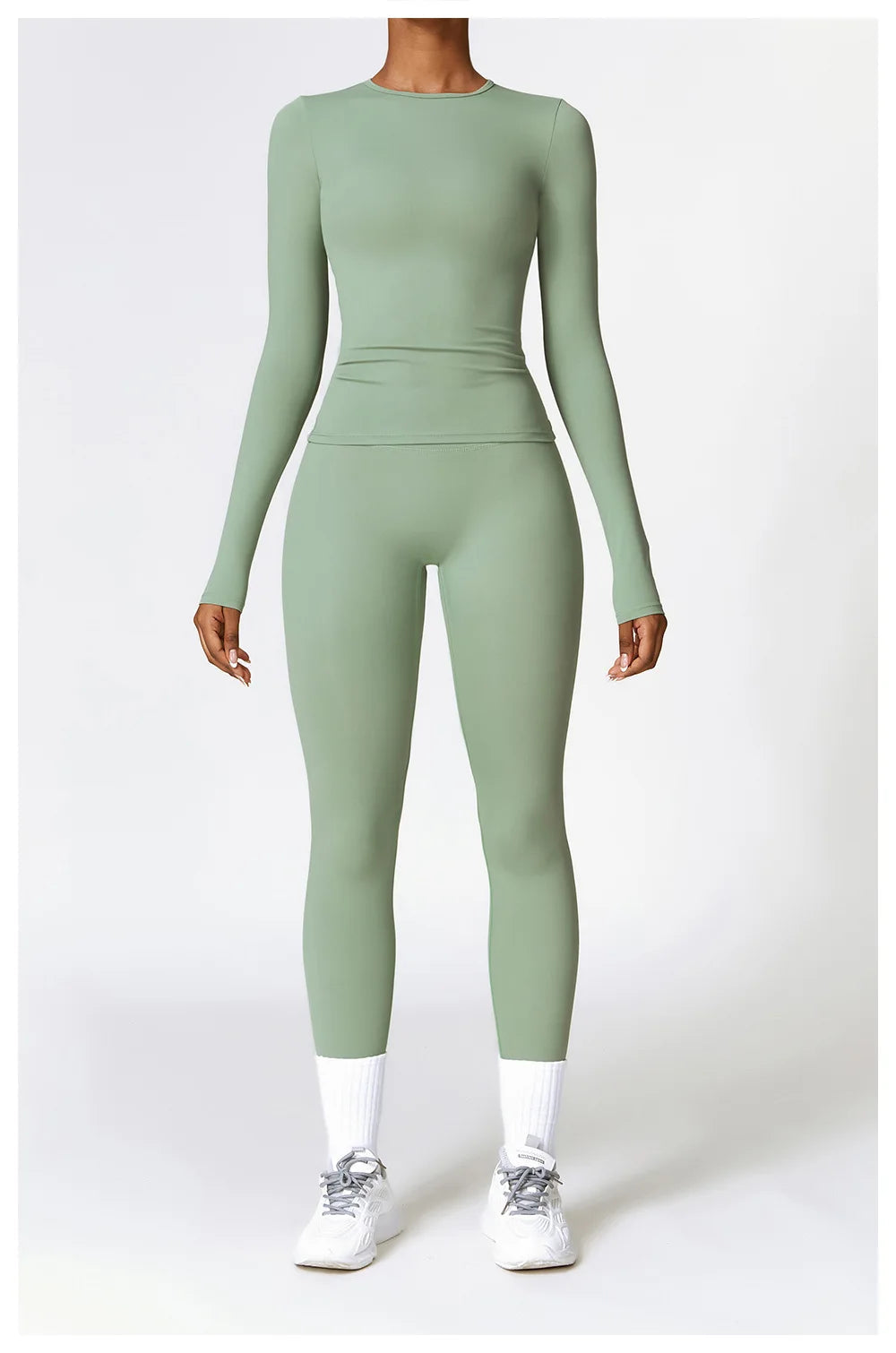 Stylish long-sleeve yoga shirt in a calming green hue, crafted from a quick-dry, breathable nylon and spandex blend. This slim-fit top offers both comfort and a flattering silhouette, making it perfect for yoga, running, or gym