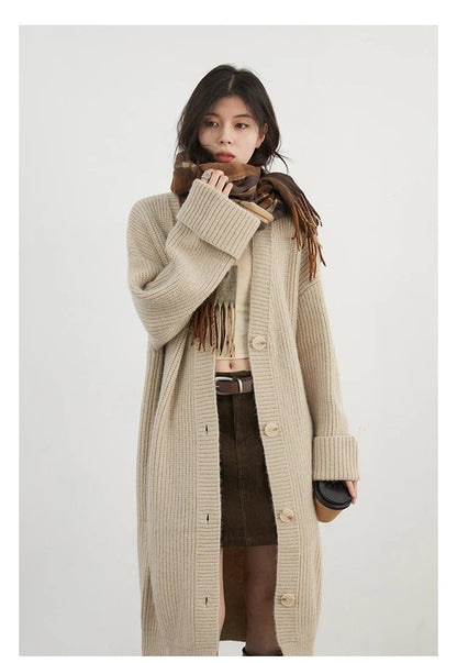 Effortlessly chic, this Korean Loose Knitted Cardigan & Long Coat combines luxurious softness with a relaxed oversized fit. Perfect for layering, its timeless button closure adds versatility to any outfit. Available in neutral shades, this cardigan-coat hybrid is the