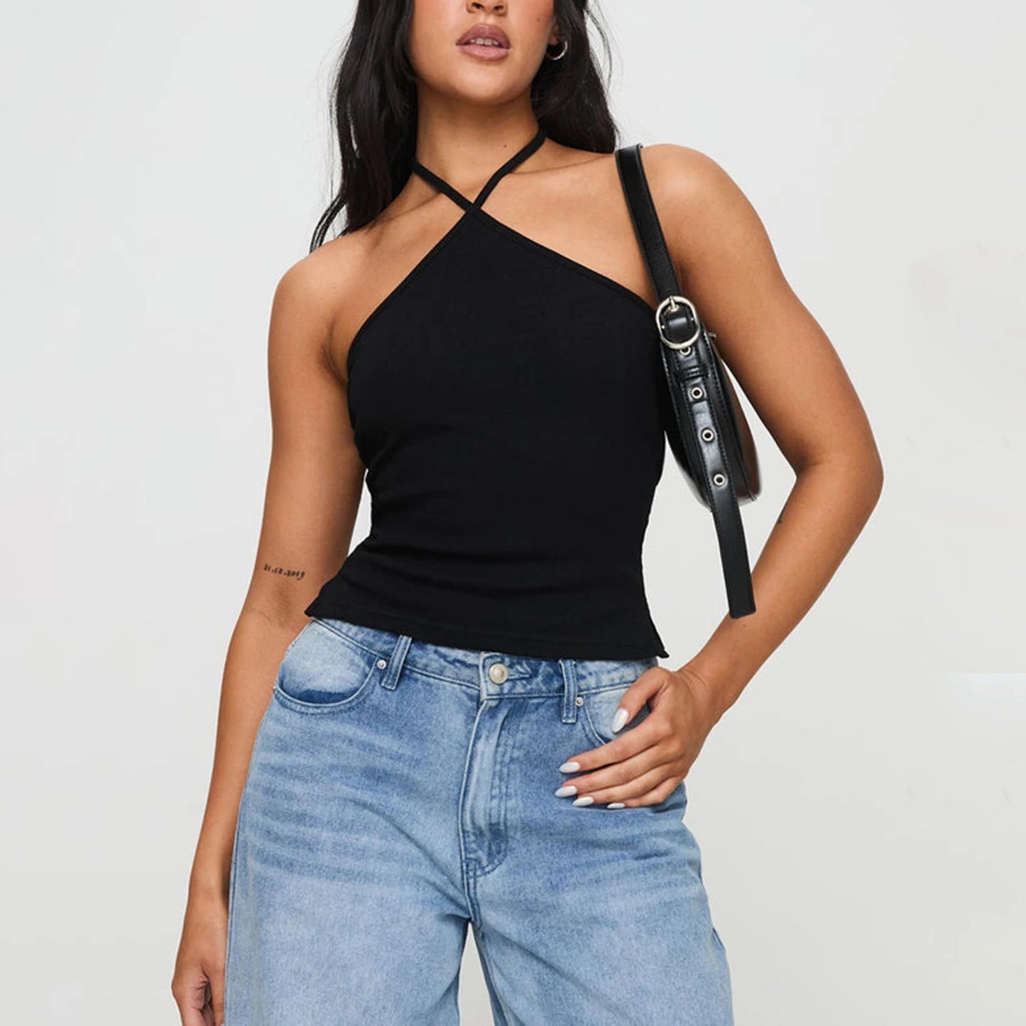 Elevate your summer wardrobe with the Gaono Chic Solid Hanging Neck Camisole. This stylish backless tank top features a trendy hanging neck design and a slim-fit silhouette, perfect for showcasing your confidence. Made from a soft, stretchy cotton-spandex