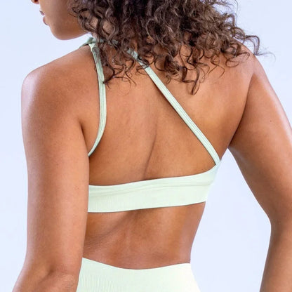 Elevate your fitness wardrobe with the NCLAGEN Impact Asymmetric Sports Bra. This stylish halter design offers high support for all activities, from yoga to intense workouts. Made with quick-dry, breathable nylon fabric, it ensures maximum comfort while keeping