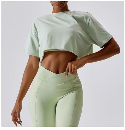 Stylish NCLAGEN Casual T-shirt in a refreshing mint green, crafted from soft, breathable cotton and spandex. This trendy crop top offers a loose fit for unrestricted movement, perfect for yoga, dance, or casual outings. Experience ultimate comfort and