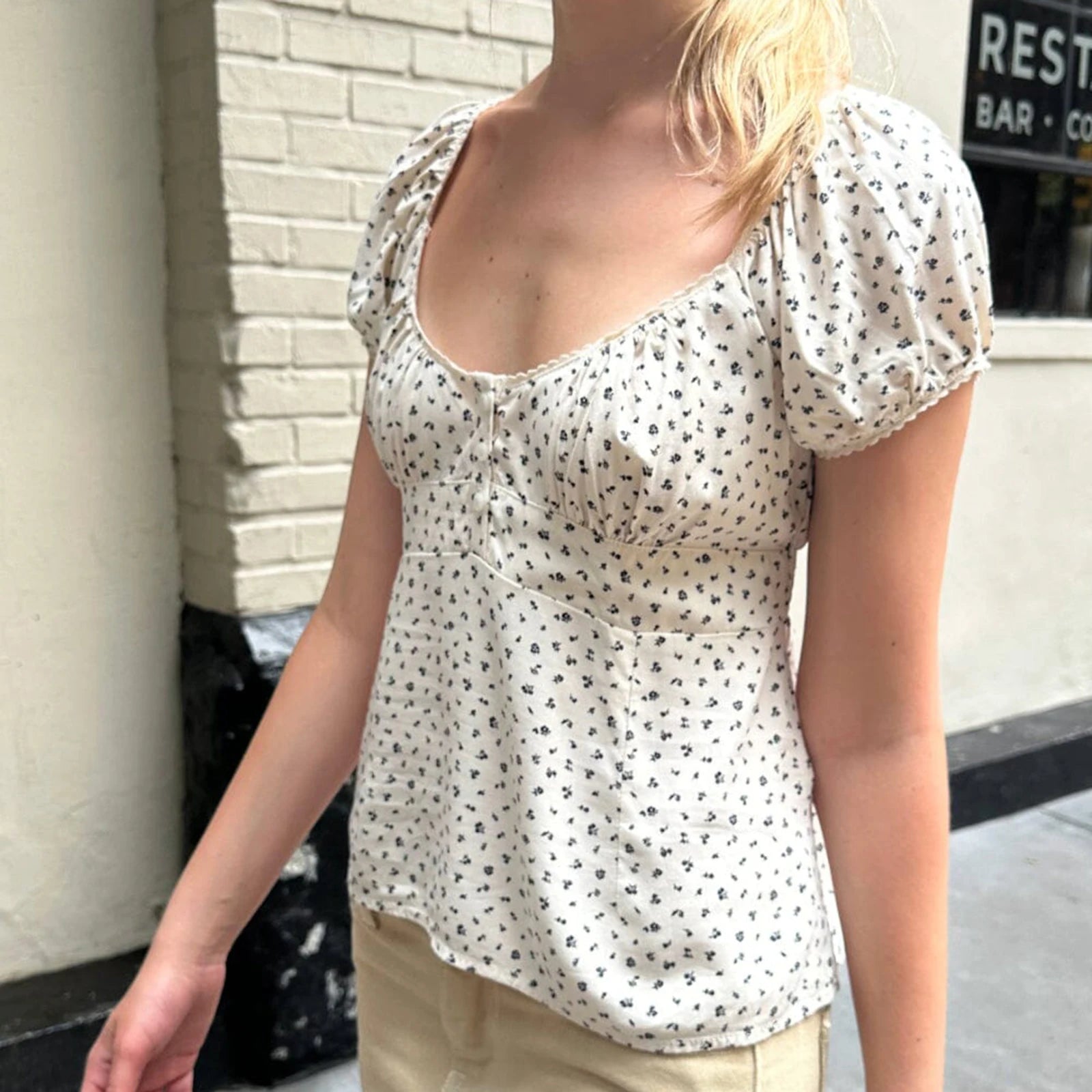 Charming Gaono Y2K Fairy Cottage Vintage T-shirt showcasing a delightful fairy tale pattern and whimsical lace details. Crafted from a soft polyester and spandex blend, this shirt offers all-day comfort with a flattering fit. Perfect for summer outings, it