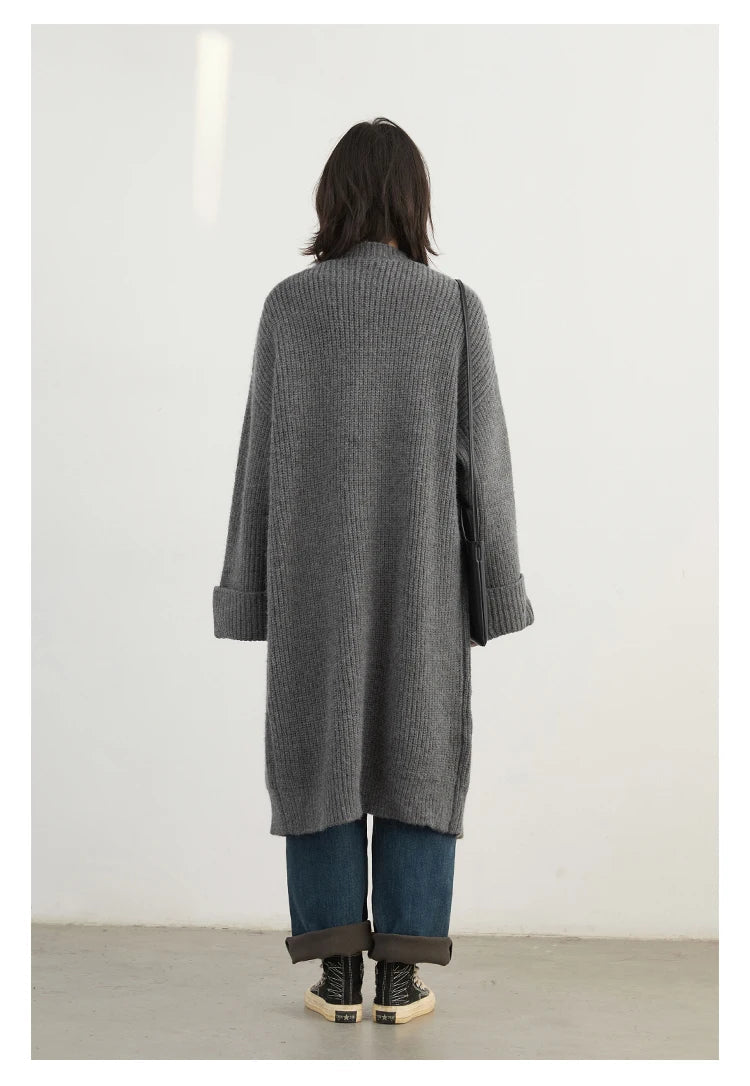 Discover the ultimate in comfort and style with our Korean Loose Knitted Cardigan & Long Coat. This chic oversized piece is crafted from luxuriously soft knitted fabric, ensuring a cozy fit that flatters every silhouette. With its timeless design and button closure