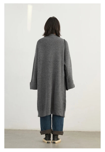 Discover the ultimate in comfort and style with our Korean Loose Knitted Cardigan & Long Coat. This chic oversized piece is crafted from luxuriously soft knitted fabric, ensuring a cozy fit that flatters every silhouette. With its timeless design and button closure