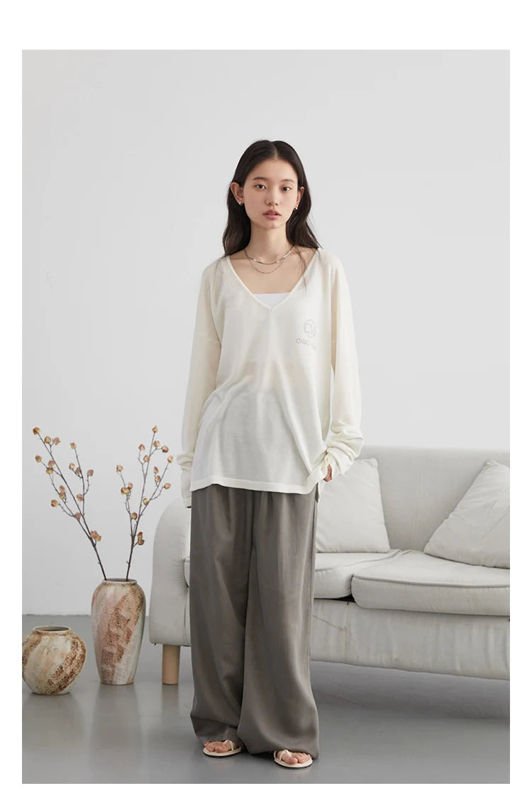 Elevate your wardrobe with our Loose V-Neck Embroidered T-Shirt, perfect for Spring/Summer 2024. This stylish tee features lightweight, breathable fabric that keeps you cool and offers natural sun protection. With elegant embroidered details and a loose