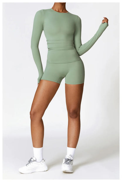 Elevate your activewear collection with the NCLAGEN Yoga Shirt! This long-sleeve top, crafted from a quick-dry, breathable nylon and spandex blend, offers unmatched comfort for yoga, running, or gym sessions. The flattering slim