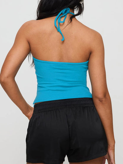 Stylish and comfortable Gaono Chic Solid Hanging Neck Camisole, perfect for summer fashion. This backless, slim-fit tank top features a trendy hanging neck design and is made from a soft cotton-spandex blend for all-day comfort. Available in
