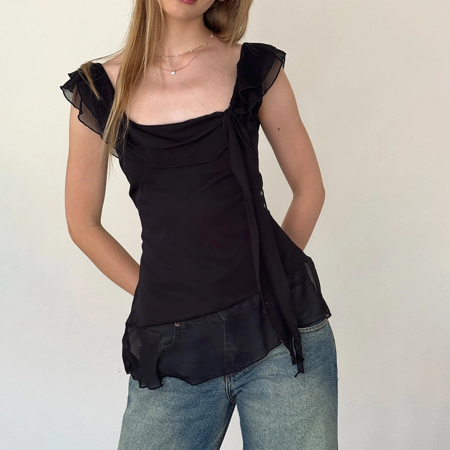 Discover the Gaono Y2K Fairy Crop Top, a must-have addition to your summer wardrobe! This stylish ruffle-trim tank top features a square neck design and lightweight chiffon, perfect for warm days and nights. Made from a soft cotton and