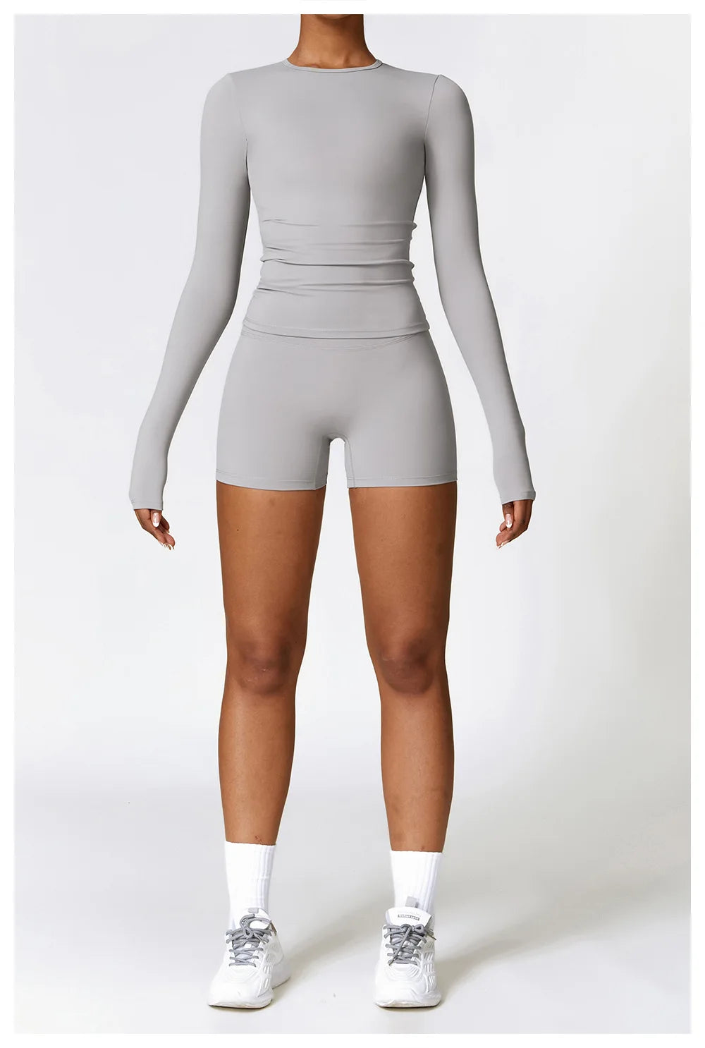 Elevate your activewear collection with the NCLAGEN Yoga Shirt! This long-sleeve top showcases a sleek, slim fit that flatters your silhouette while offering exceptional comfort. Made from a quick-dry, breathable nylon and spandex blend,