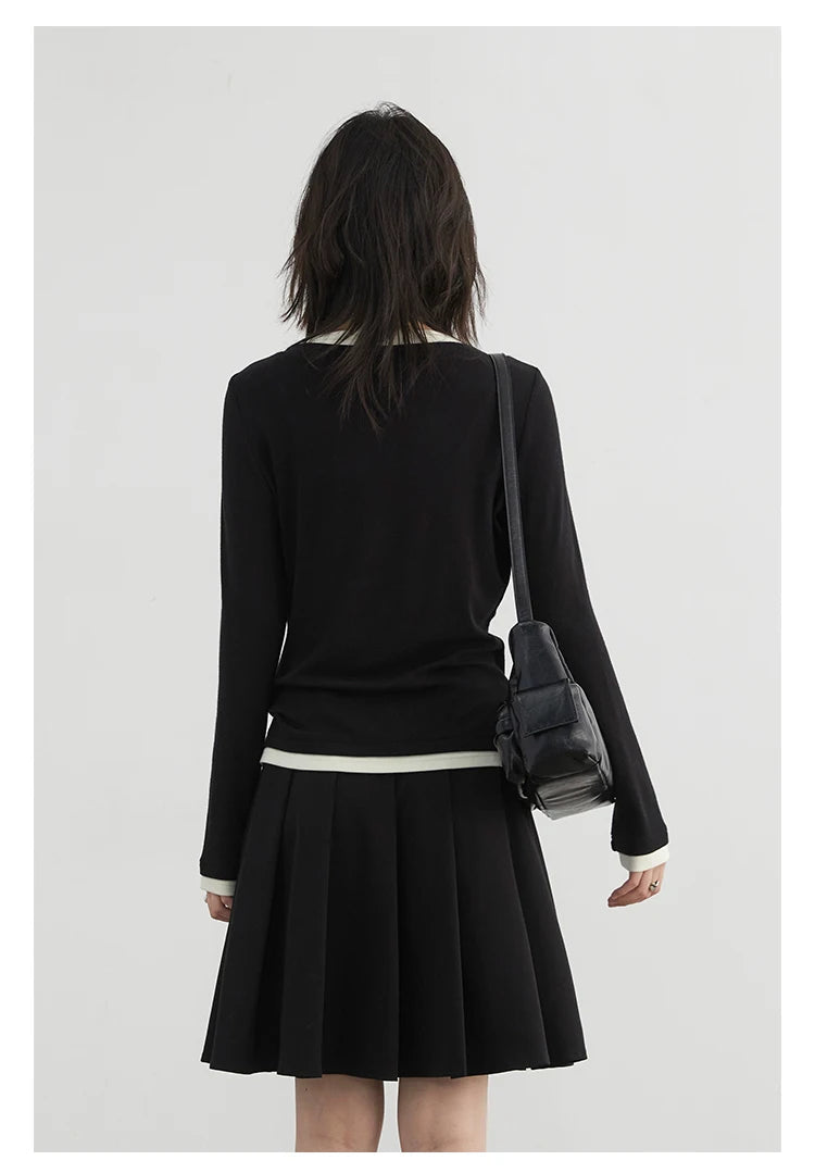 Cozy loose-fit knitted sweater in classic black, designed for effortless elegance and all-day comfort. Crafted from soft, breathable fabric, this long sleeve top is perfect for layering and versatile enough for both casual and dressy occasions. Available in multiple colors to