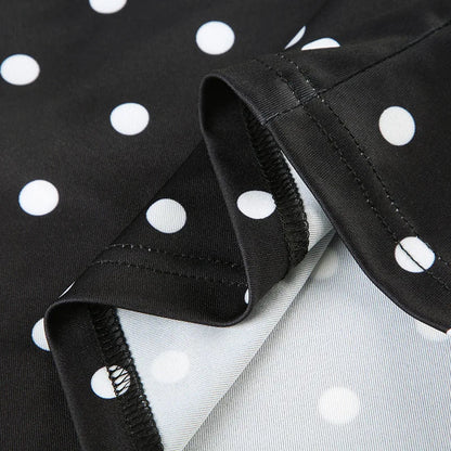 Elevate your summer wardrobe with the Gaono Asymmetrical Polka Dot Tank Top! This stylish piece features a striking black and white polka dot pattern, crafted from lightweight and breathable polyester for ultimate comfort. The unique asymmetrical design, complemented by