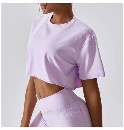 Stylish NCLAGEN Casual T-shirt in a soft lavender hue, designed for ultimate comfort and breathability. This trendy crop top features a loose fit, making it perfect for yoga, dance, or casual outings. Experience freedom of movement while looking chic