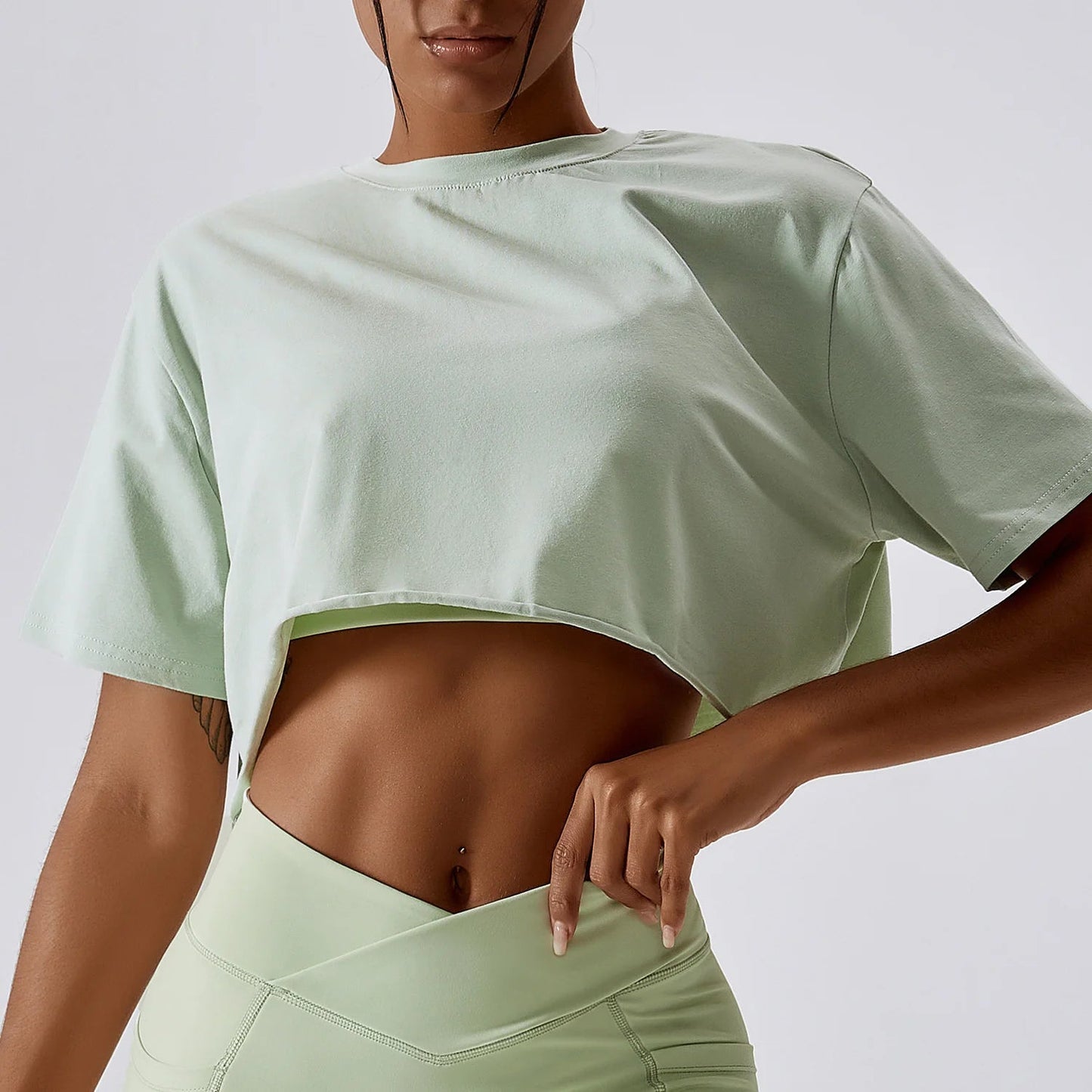 Stylish NCLAGEN Casual T-shirt in a chic crop design, crafted from soft, breathable cotton and spandex for ultimate comfort. Perfect for yoga, dance, or running, this loose-fit top ensures unrestricted movement while keeping you fresh with quick-d