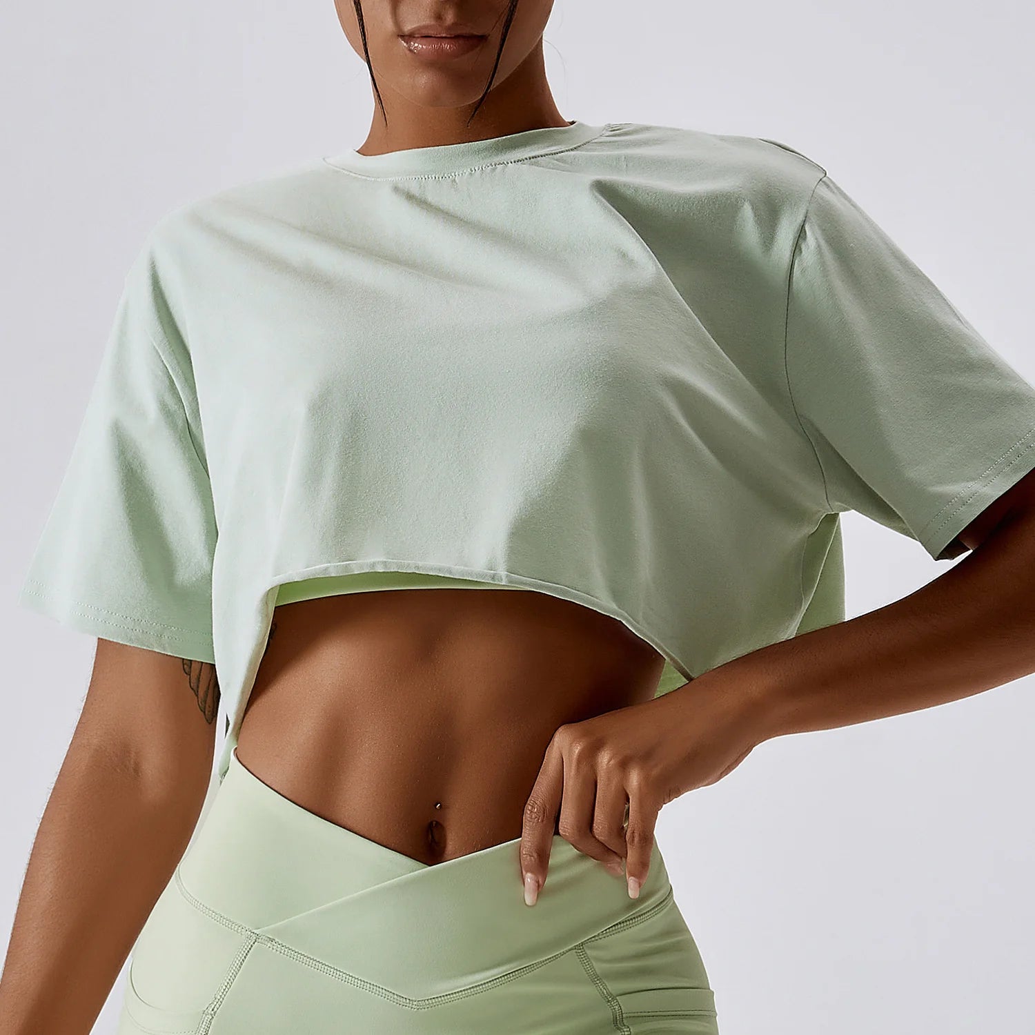 Stylish NCLAGEN Casual T-shirt in a chic crop design, crafted from soft, breathable cotton and spandex for ultimate comfort. Perfect for yoga, dance, or running, this loose-fit top ensures unrestricted movement while keeping you fresh with quick-d