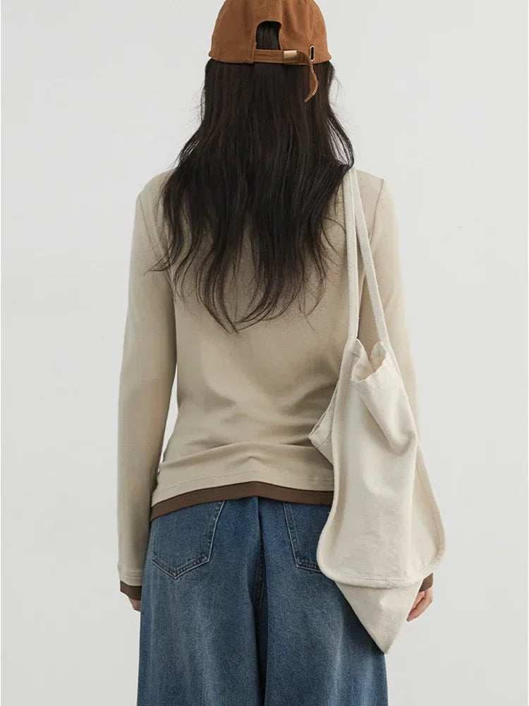 Cozy and chic loose-fit knitted sweater and long sleeve top, crafted from soft, breathable fabric for all-day comfort. Perfect for layering and transitioning between seasons, this versatile piece adds elegance to any outfit. Available in multiple colors to suit your unique style