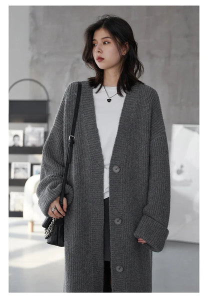 Discover the ultimate in comfort and style with our Korean Loose Knitted Cardigan & Long Coat. This chic, oversized cardigan is crafted from luxuriously soft knitted fabric, ensuring a cozy fit that flatters all body types. Its timeless design features a