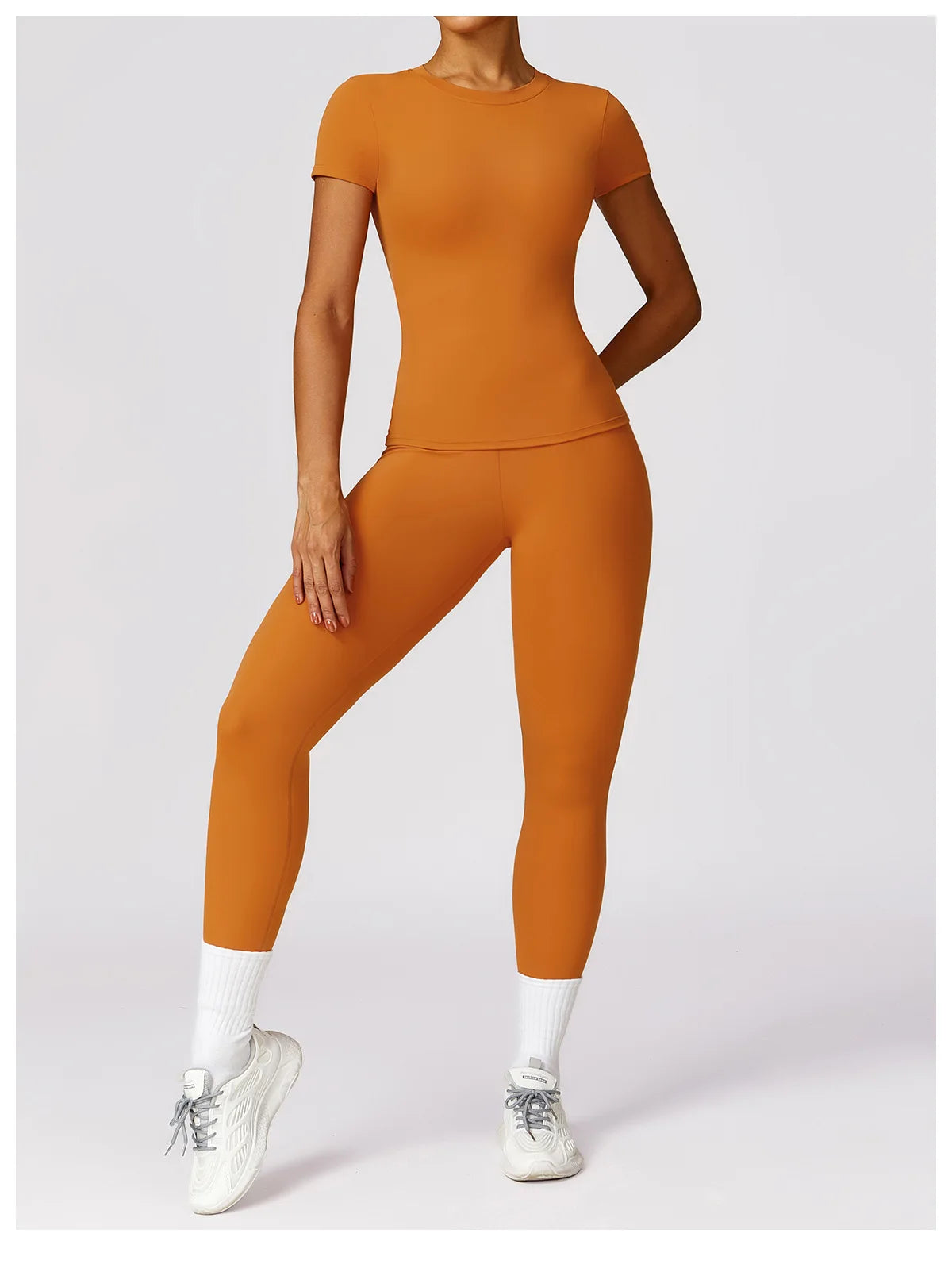 Elevate your fitness wardrobe with the NCLAGEN Short Sleeve T-Shirt, crafted from lightweight, breathable nylon for ultimate comfort. This stylish gym wear features a fitted silhouette and round neck, perfect for yoga, running, or casual outings. Available in a