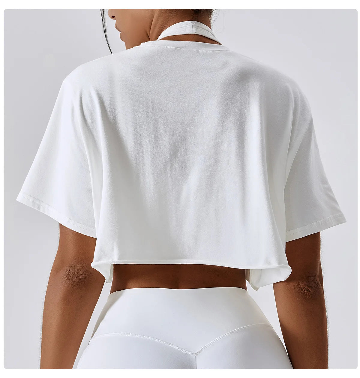 Stylish NCLAGEN Casual T-shirt in classic white, designed for ultimate comfort and functionality. Made from soft, breathable cotton and spandex, this trendy crop top offers a loose fit, perfect for yoga, dance, or running. Enjoy unrestricted movement