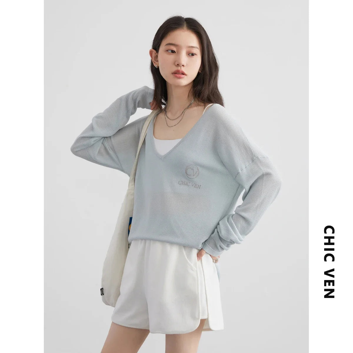 Discover our **Loose V-Neck Embroidered T-Shirt**, perfect for Spring/Summer 2024. This stylish tee features lightweight, breathable fabric that offers natural sun protection while keeping you cool. The beautifully embroidered details add an elegant touch, while