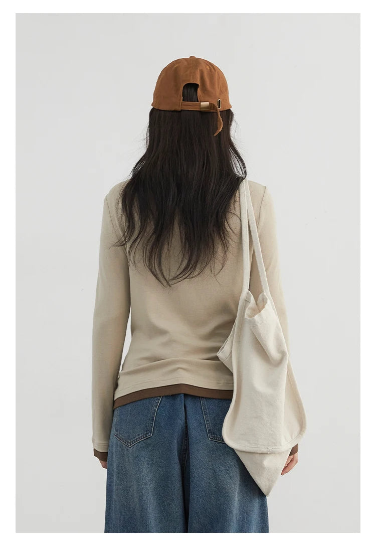 Cozy and stylish, our Loose-Fit Knitted Sweater & Long Sleeve Top is crafted from soft, breathable fabric for all-day comfort. The versatile design features chic long sleeves and a loose fit, perfect for layering in any season. Available in