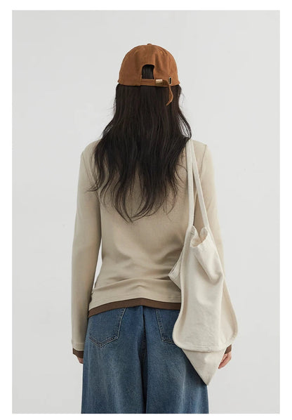 Cozy and stylish, our Loose-Fit Knitted Sweater & Long Sleeve Top is crafted from soft, breathable fabric for all-day comfort. The versatile design features chic long sleeves and a loose fit, perfect for layering in any season. Available in