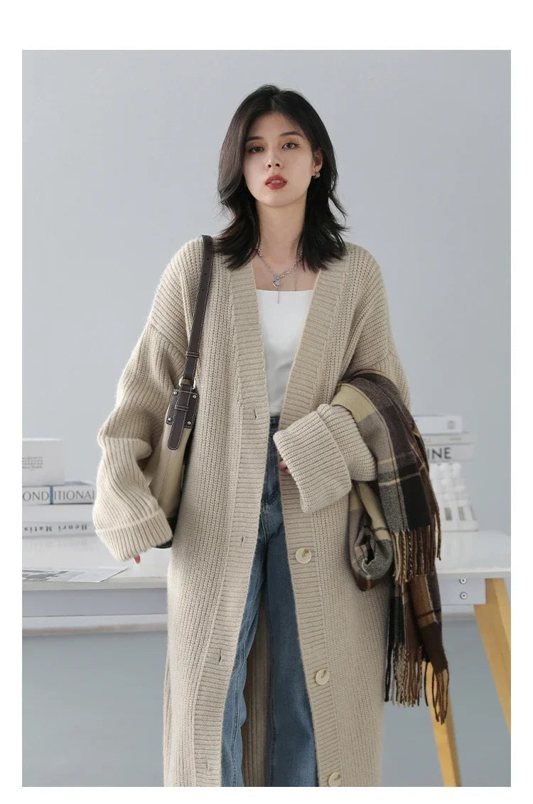 Effortlessly chic Korean Loose Knitted Cardigan & Long Coat, crafted from luxuriously soft knitted fabric for ultimate comfort. This oversized, relaxed-fit design features a timeless button closure, making it perfect for layering. Available in neutral colors, it