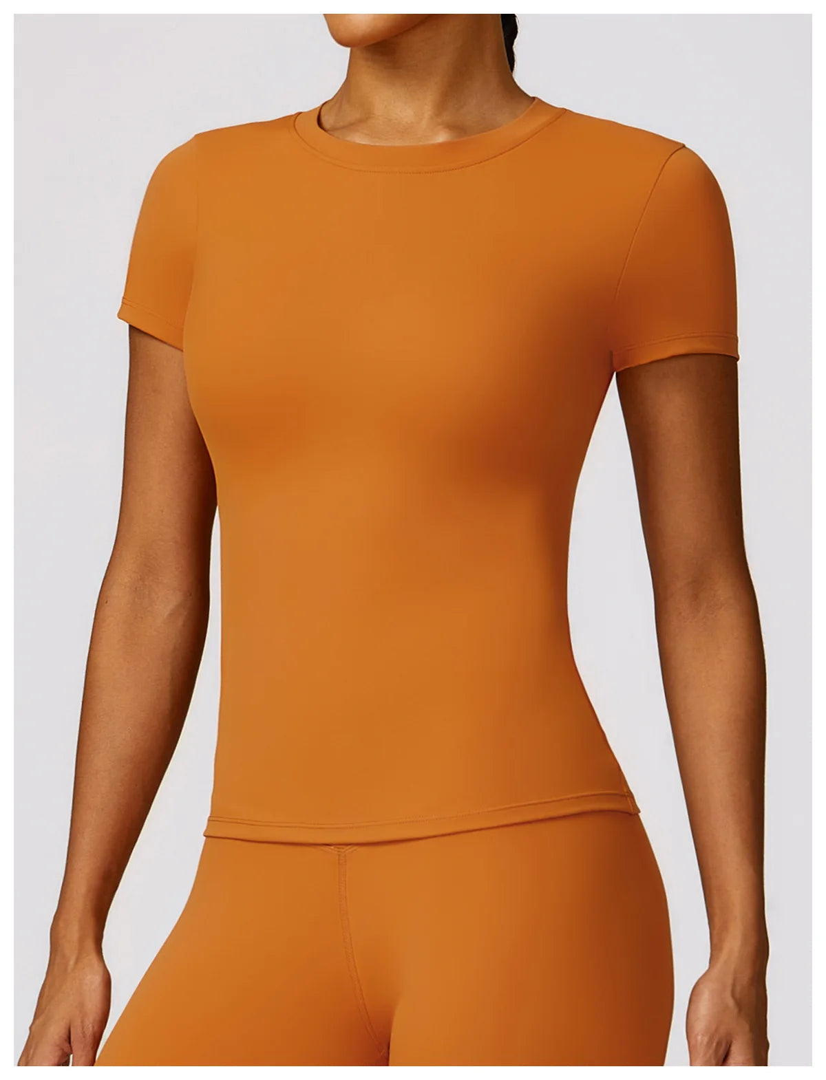 Elevate your fitness wardrobe with the NCLAGEN Short Sleeve T-Shirt, crafted from lightweight, breathable nylon for ultimate comfort. This stylish gym wear features a fitted silhouette and round neck, perfect for workouts, yoga, or casual outings. Available in a