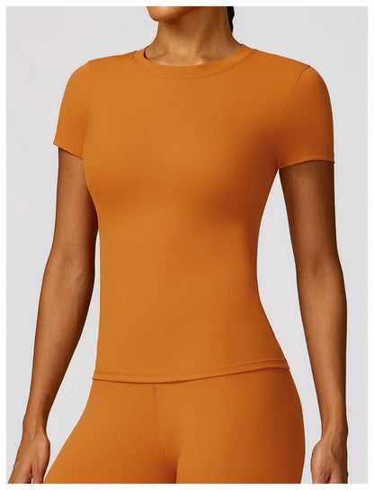 Elevate your fitness wardrobe with the NCLAGEN Short Sleeve T-Shirt, crafted from lightweight, breathable nylon for ultimate comfort. This stylish gym wear features a fitted silhouette and round neck, perfect for workouts, yoga, or casual outings. Available in a