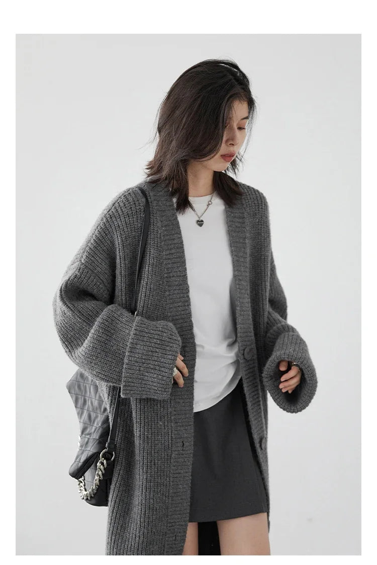 Discover the ultimate in comfort and style with our **Korean Loose Knitted Cardigan & Long Coat**. Crafted from luxuriously soft knitted fabric, this oversized cardigan features a relaxed silhouette that flatters every figure. The timeless design includes a button