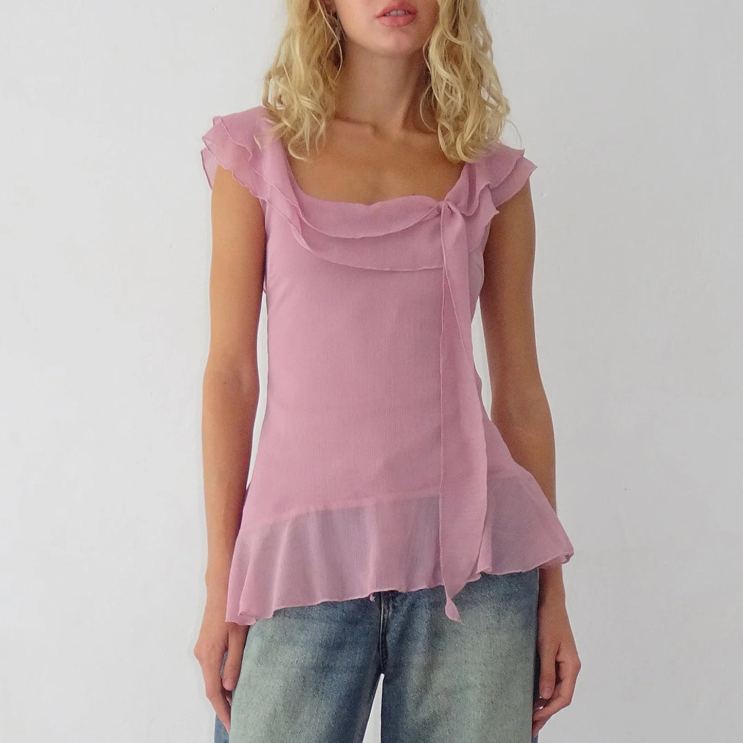 Elevate your summer style with the Gaono Y2K Fairy Crop Top! This enchanting ruffle-trim tank top features a square neck design crafted from a soft cotton and polyester blend, ensuring comfort and a flattering fit. Perfectly paired with high