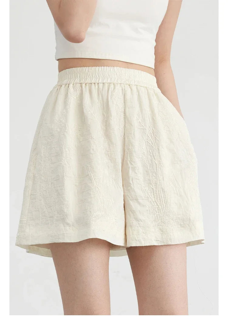 Elevate your wardrobe with the stunning Embroidered Chinese Blouse & Shorts Set. This chic outfit features intricate Chinese embroidery, crafted from soft, breathable fabric for ultimate comfort. The relaxed fit flatters any silhouette, while the coordinated shorts complete the elegant