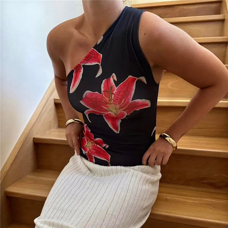 Elevate your summer style with the Gaono Floral Print Fitted Top! This chic one-shoulder tank features a vibrant floral design on a soft, breathable cotton-polyester blend, perfect for warm weather. With its trendy backless style and medium