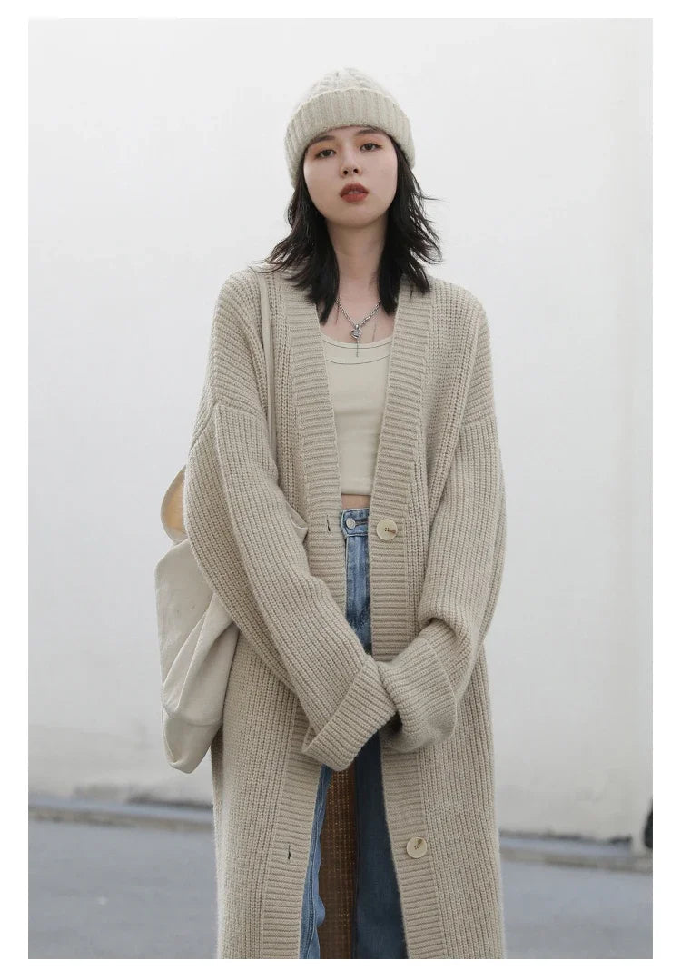 Introducing the **Korean Loose Knitted Cardigan & Long Coat**—a must-have for the modern woman seeking effortless elegance. Crafted from luxuriously soft knitted fabric, this oversized fit piece offers a cozy and relaxed silhouette that flatters every body