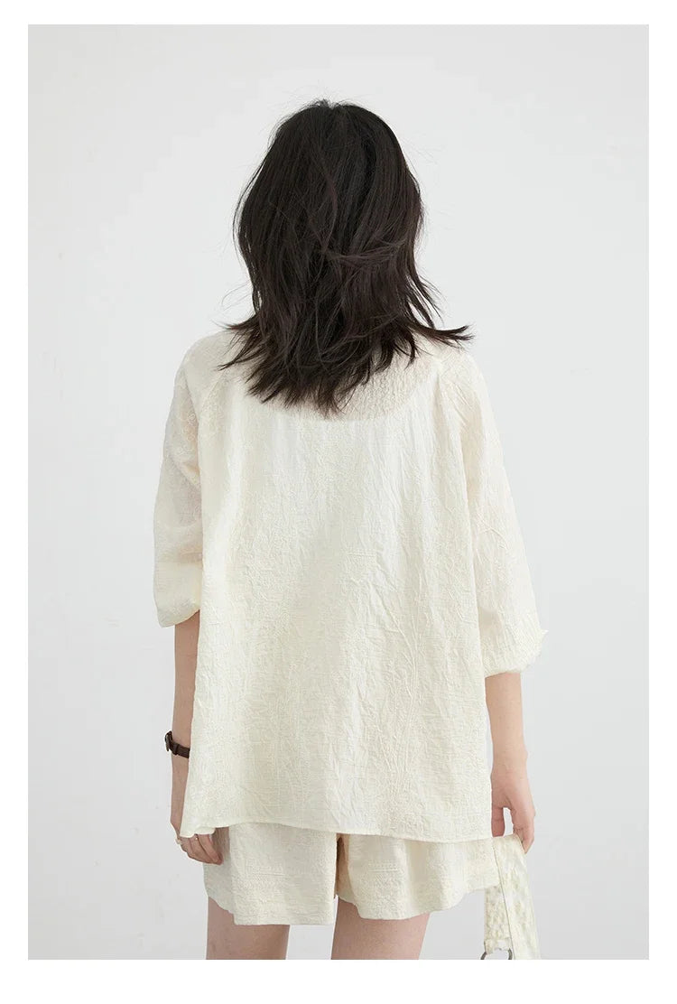 Discover effortless elegance with our Embroidered Chinese Blouse & Shorts Set. This chic outfit features intricate Chinese embroidery, crafted from soft, breathable fabric for ultimate comfort. The relaxed fit flatters any silhouette, while the coordinated shorts complete your stylish look.