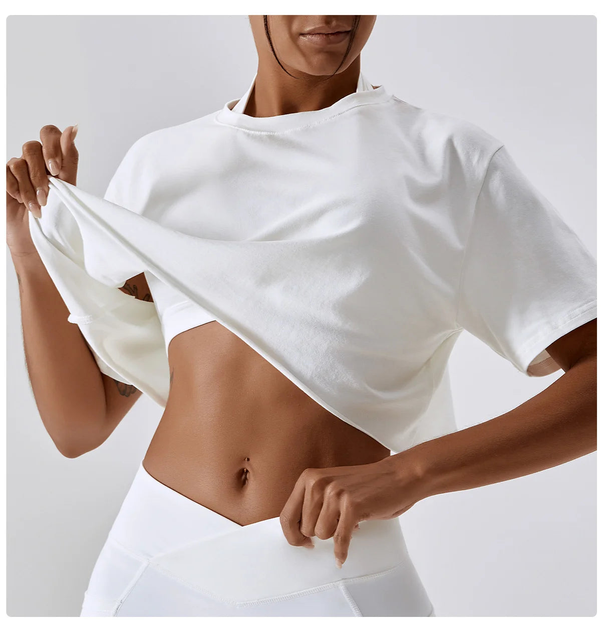 Stylish NCLAGEN Casual T-shirt featuring a cropped design and made from soft, breathable cotton and spandex. Perfect for yoga, dance, or running, this loose-fit top ensures unrestricted movement and quick-dry comfort. Elevate your workout wardrobe