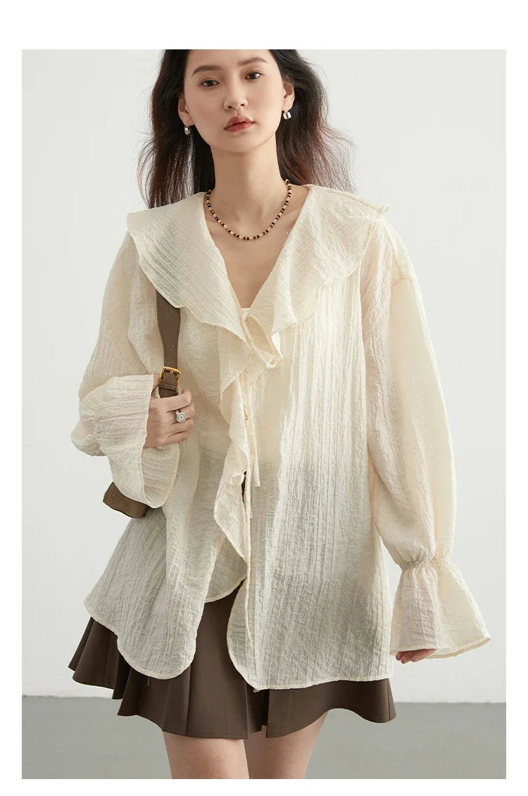 Effortlessly chic Ruffled V-Neck Lace-Up Blouse, perfect for spring and summer. This stylish blouse features a beautiful ruffled neckline, playful lace-up detailing, and a loose fit for ultimate comfort. Available in versatile colors, it transitions