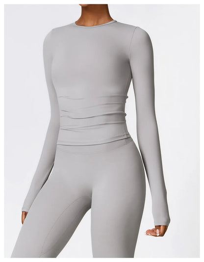 Elevate your workout wardrobe with the NCLAGEN Yoga Shirt, a stylish long-sleeve top designed for ultimate comfort and performance. Made from a quick-dry nylon and spandex blend, this breathable shirt offers a flattering slim fit, perfect for