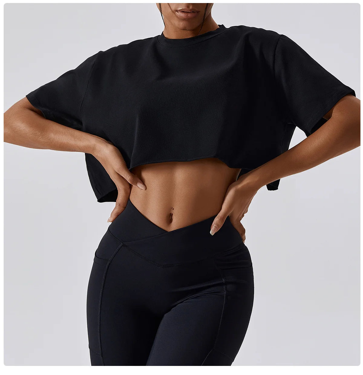 Stylish NCLAGEN Casual T-shirt in classic black, designed for ultimate comfort and freedom of movement. Crafted from breathable cotton and spandex, this loose-fit crop top is perfect for yoga, dance, or running. Featuring quick-dry technology,