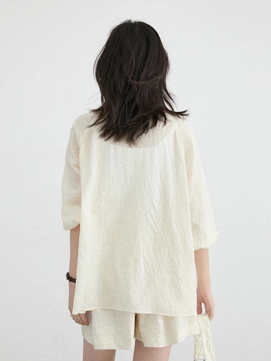 Chic embroidered Chinese blouse and shorts set, crafted from soft, breathable fabric for ultimate comfort. This elegant outfit features intricate embroidery, a relaxed fit for flattering silhouettes, and coordinated shorts, making it perfect for warm days and stylish outings. Embrace effortless