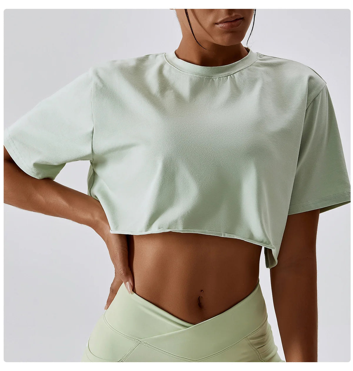 Stylish NCLAGEN Casual T-shirt in a fresh mint green hue, designed with a cropped fit for ultimate comfort and flexibility. Crafted from breathable cotton and spandex, this trendy crop top is perfect for yoga, running, or casual wear. Experience