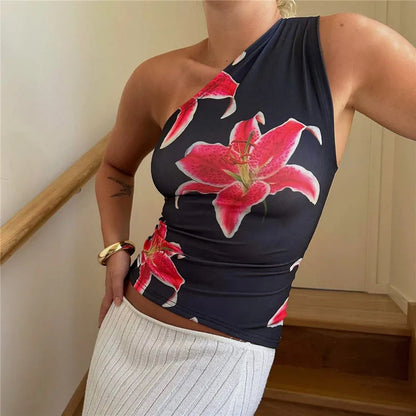 Elevate your summer style with the Gaono Floral Print Fitted Top! This chic one-shoulder tank features a stunning floral design, perfect for resort wear or casual outings. Made from a soft, breathable cotton-polyester blend, it offers a