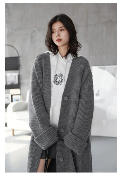 Effortlessly chic, the Korean Loose Knitted Cardigan & Long Coat is your perfect layering companion. Crafted from luxuriously soft knitted fabric, this oversized cardigan offers a cozy silhouette that flatters every figure. Featuring a timeless design with button closure