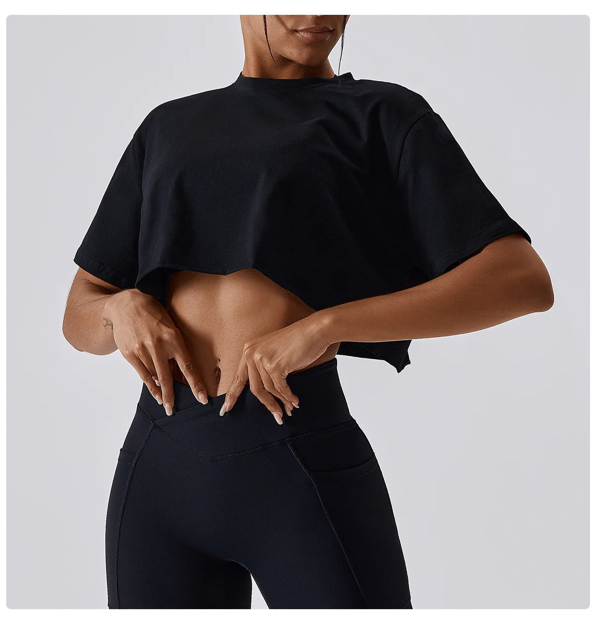 Stylish NCLAGEN Casual T-shirt in classic black, designed for ultimate comfort and functionality. This crop top features soft, breathable fabric and a loose fit, perfect for yoga, dance, or running. Stay fresh with quick-dry technology while enjoying