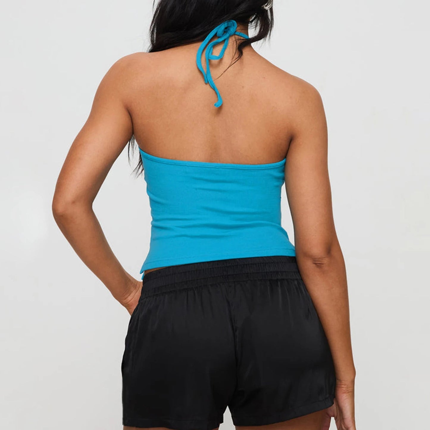 Chic solid hanging neck camisole in vibrant blue, crafted from a soft cotton-spandex blend for ultimate comfort. This backless, slim-fit tank top is perfect for summer streetwear and Y2K aesthetics. Lightweight and breathable, it pairs effortlessly
